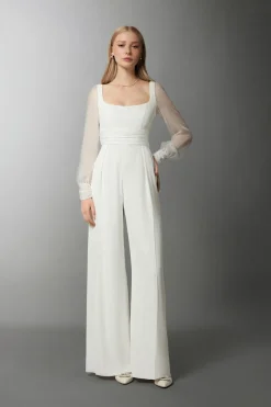 Tuta in crepe con maniche in chiffon