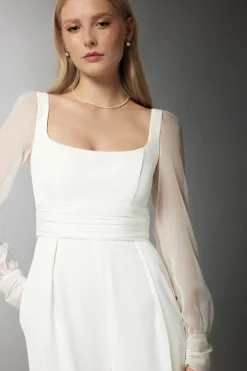 Tuta in crepe con maniche in chiffon